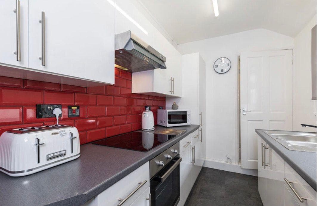 The shared kitchen of a student house on Carlton Road, with hob, oven and microwave
